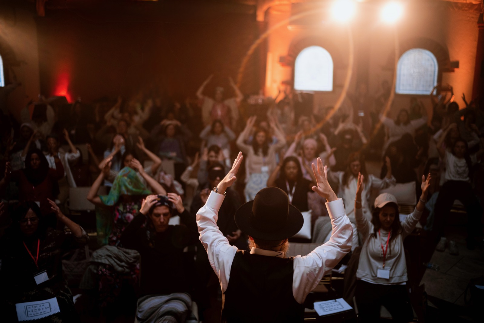 Rav Doniel teaching, arms raised