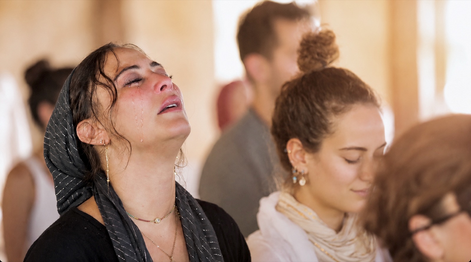 A woman moved to tears at an Elevation gathering